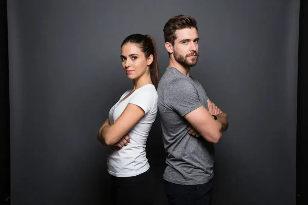 The back to back power stance confident couple pose