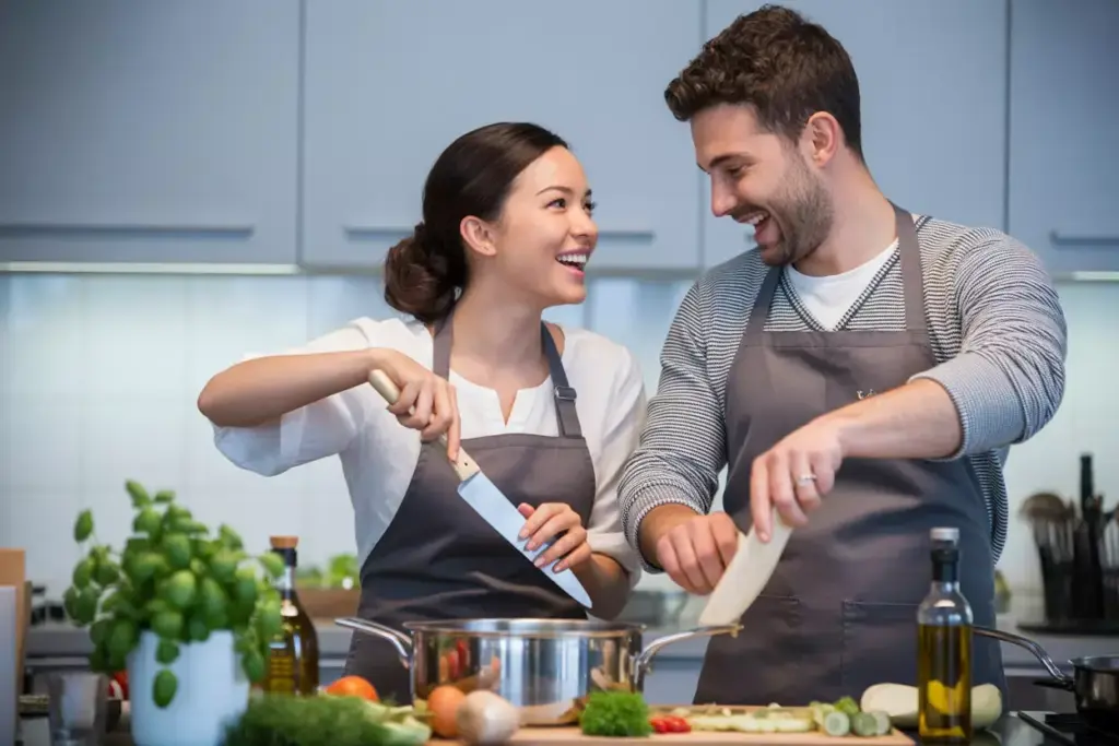 Couple enjoying cooking class together with instructor