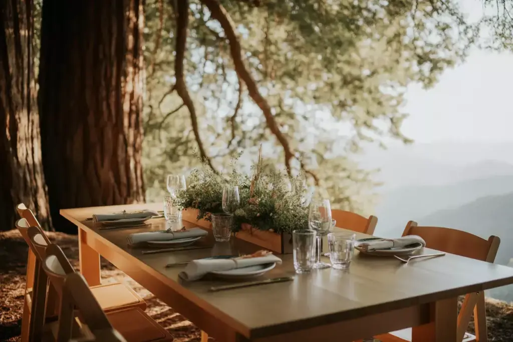 Close up of simple table setting with majestic redwood tree backdrop