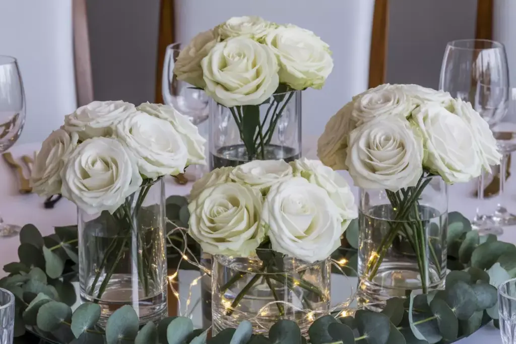 Classic white roses eucalyptus glass vases varying heights led lights
