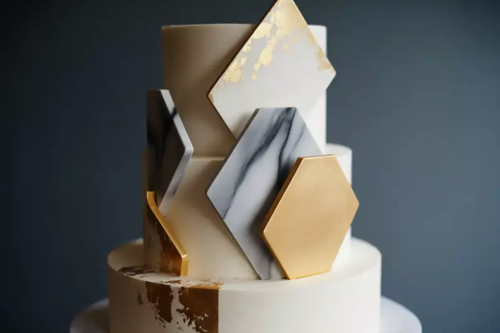 Modern hexagonal cake with gold leaf and ombre geometry