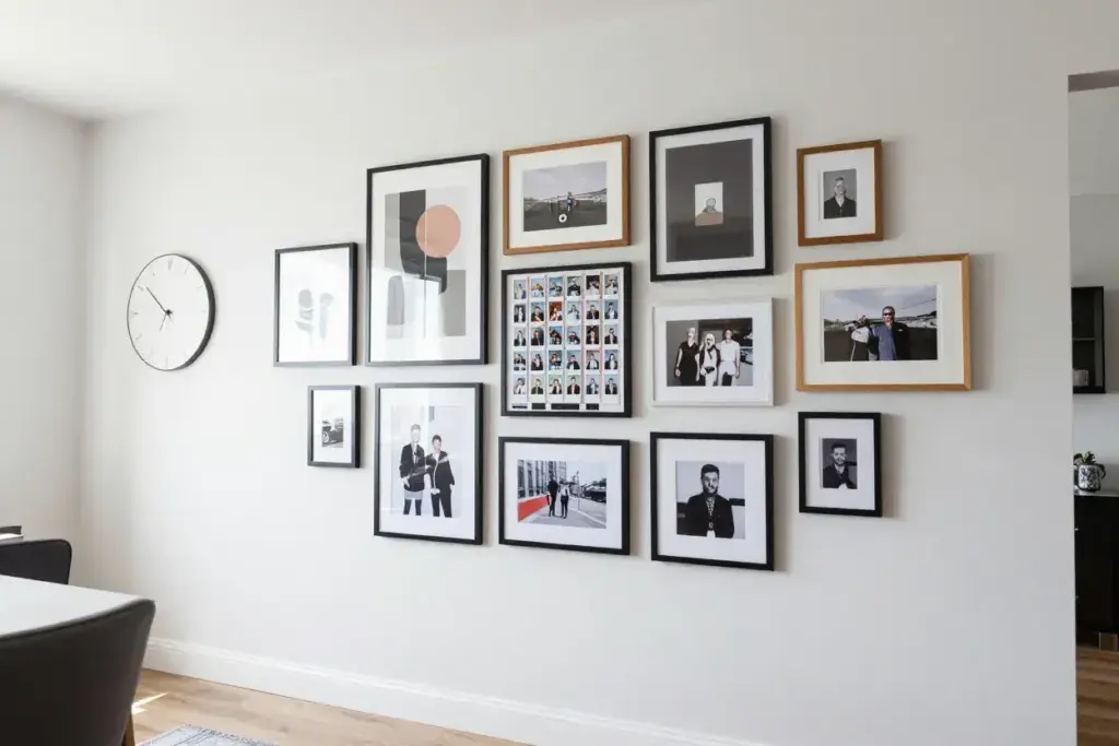 Modern gallery wall with integrated vintage photo booth strip
