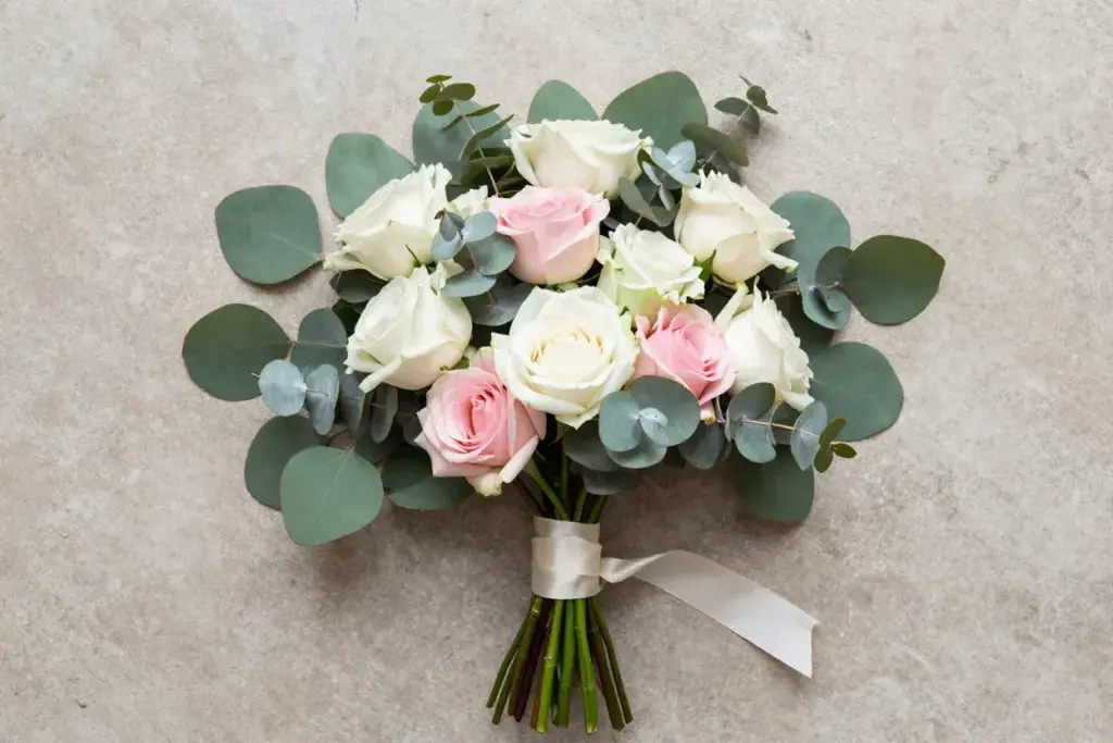 Organic garden rose eucalyptus bouquet flat lay texture