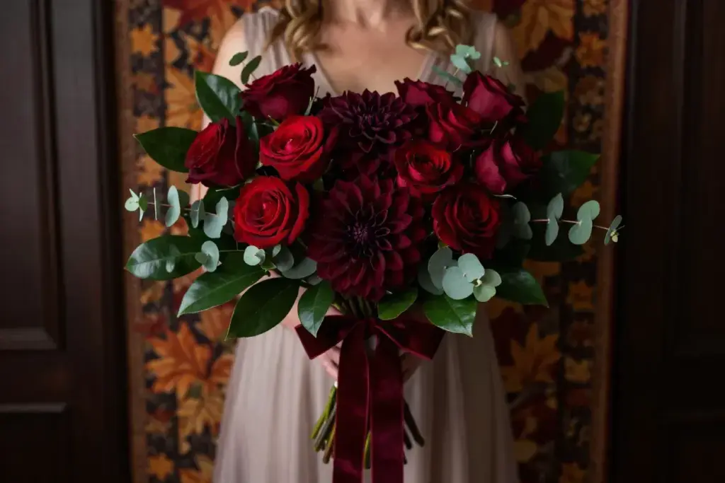 Burgundy dahlia and deep red rose bouquet with velvet ribbon