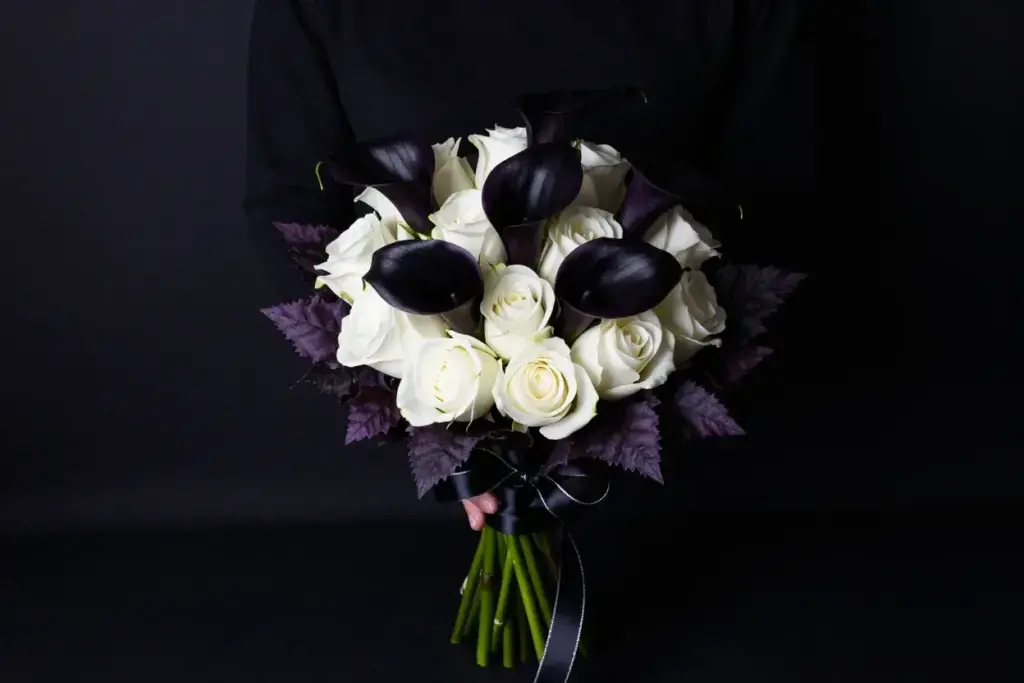 High contrast bouquet of black calla lilies and white roses