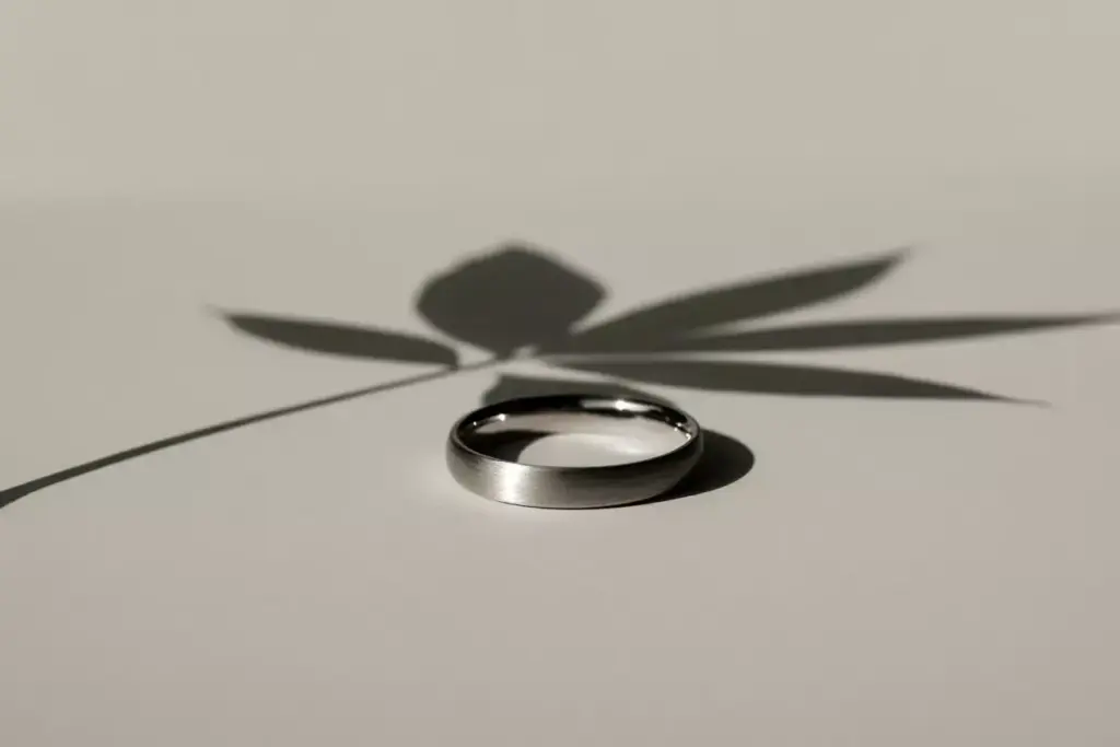 Brushed palladium minimalist band with single leaf shadow