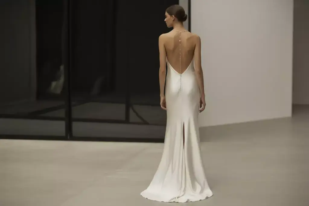Modern slip gown with plunging back and thigh high slit