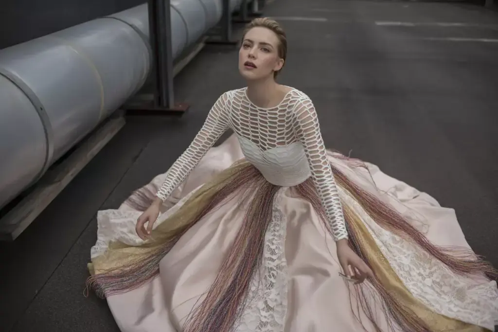 Romantic rebel gown with geometric cutouts and mixed textures