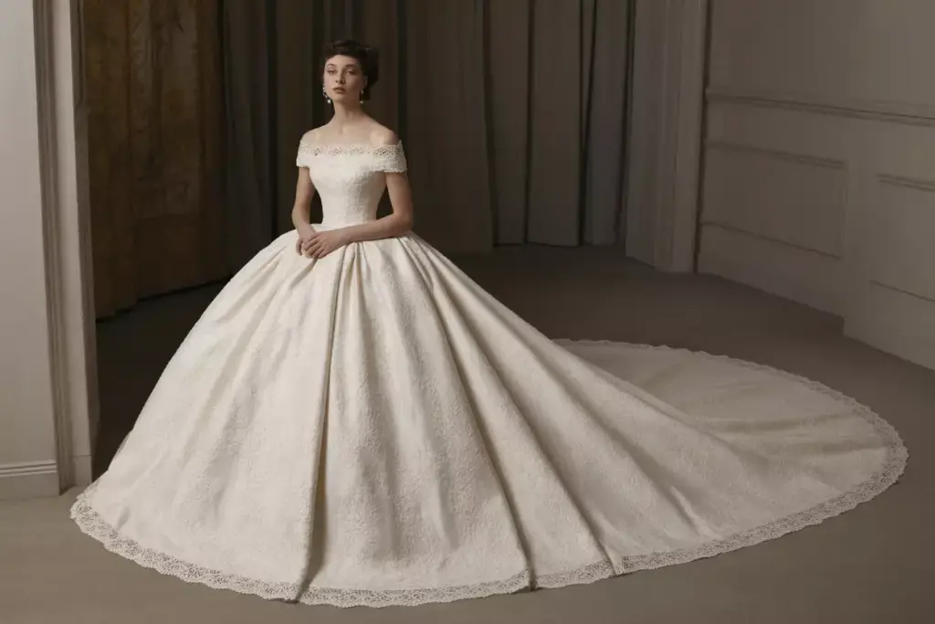 Vintage alencon lace ball gown wedding dress with cathedral train and metallic thread