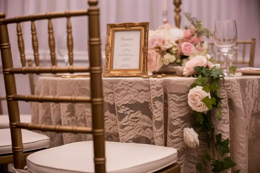 Vintage romantic table setting with gold accented chairs