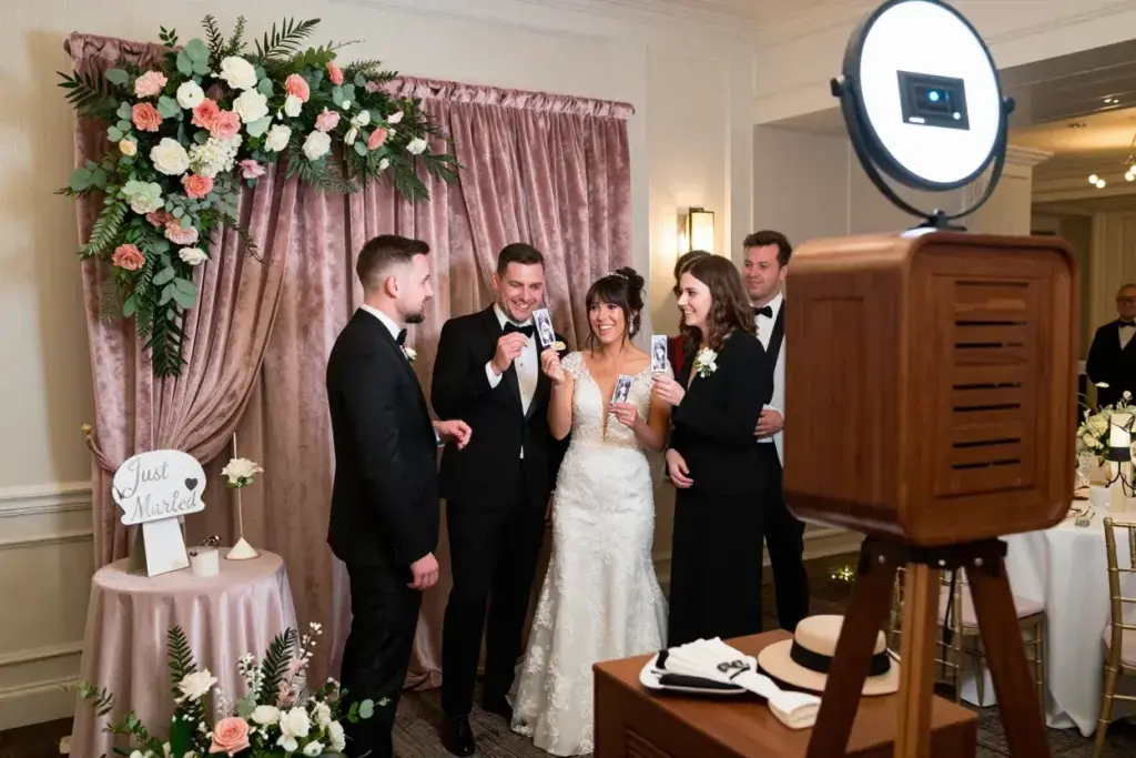 Wedding reception vintage booth decorated with matching floral arrangements