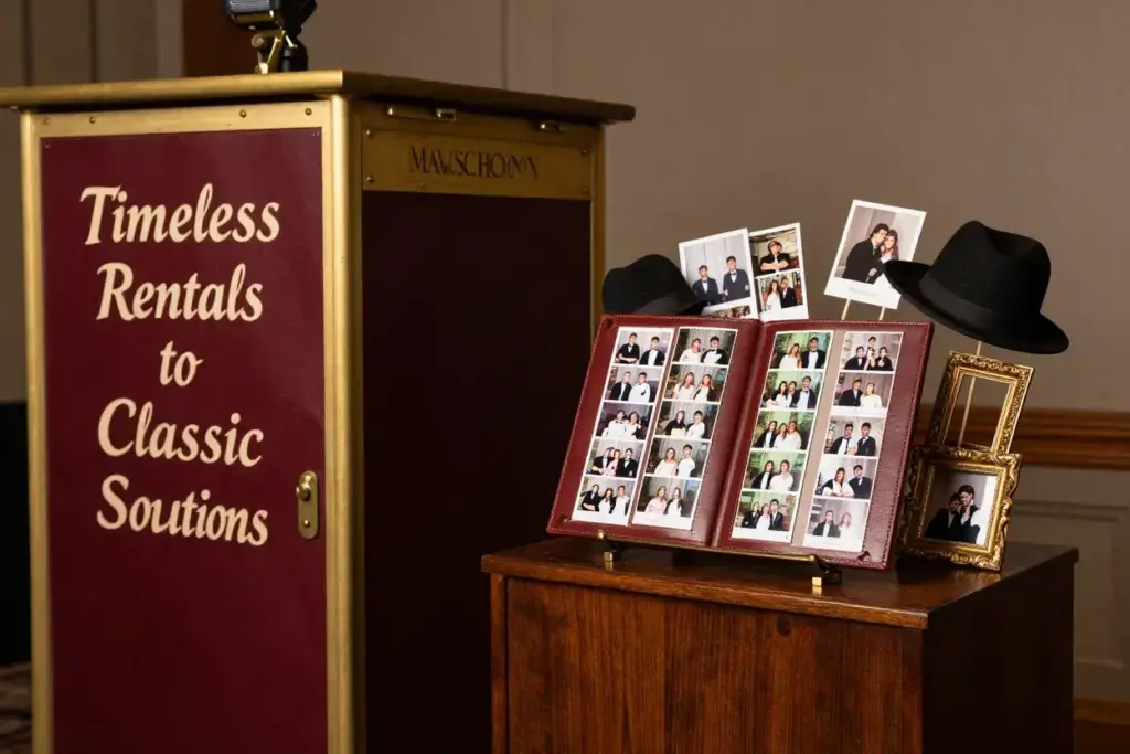 Booth with brass fittings next to leather photo strip album