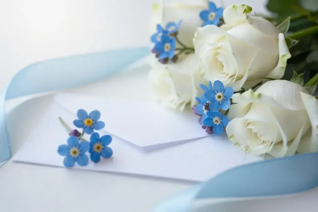 Blue forgetmenots white roses silk ribbon remembrance love bouquet