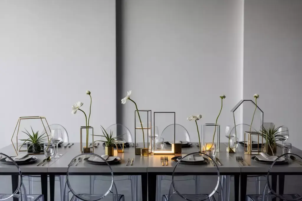 Straight on view sleek rectangular table geometric gold centerpieces