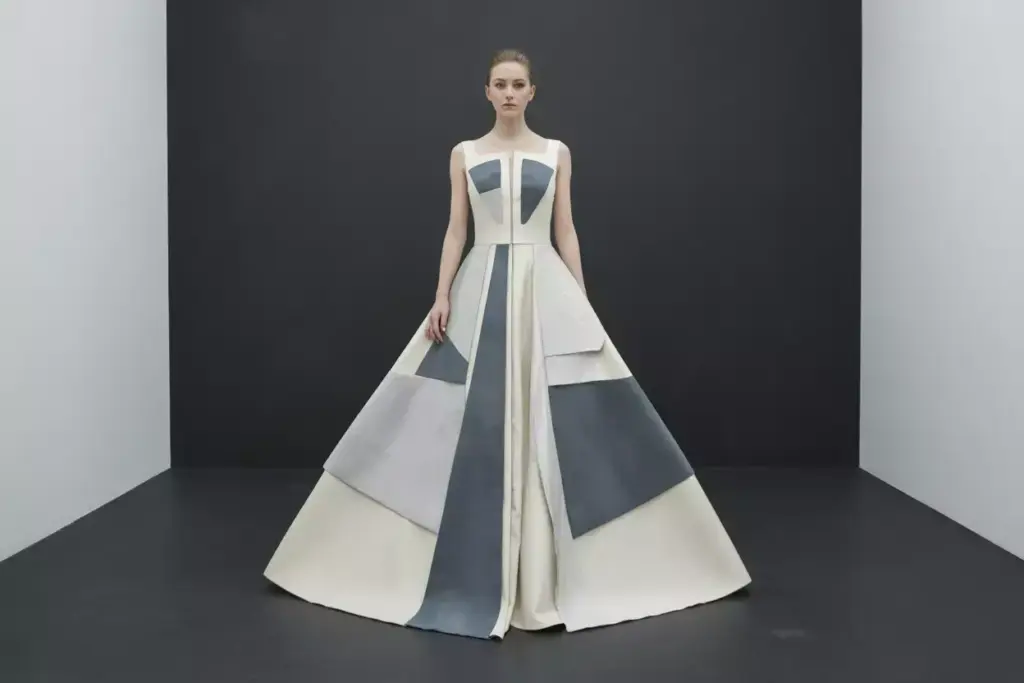 Geometric wedding gown with cutouts and mixed fabric textures