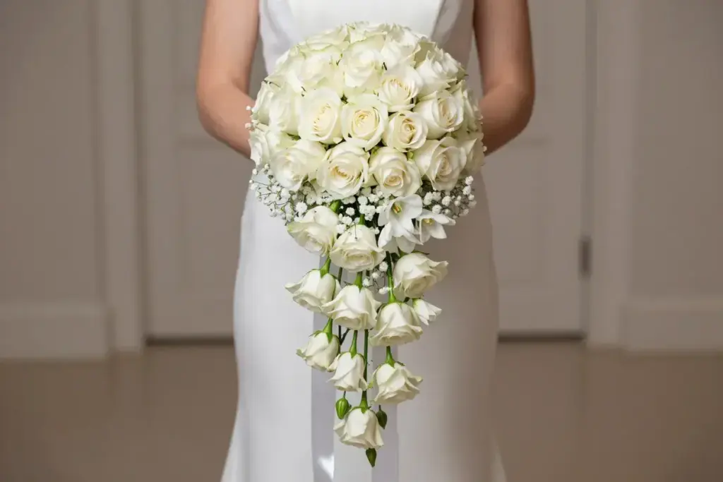 Classic white rose waterfall bouquet with baby breath ribbon cascade
