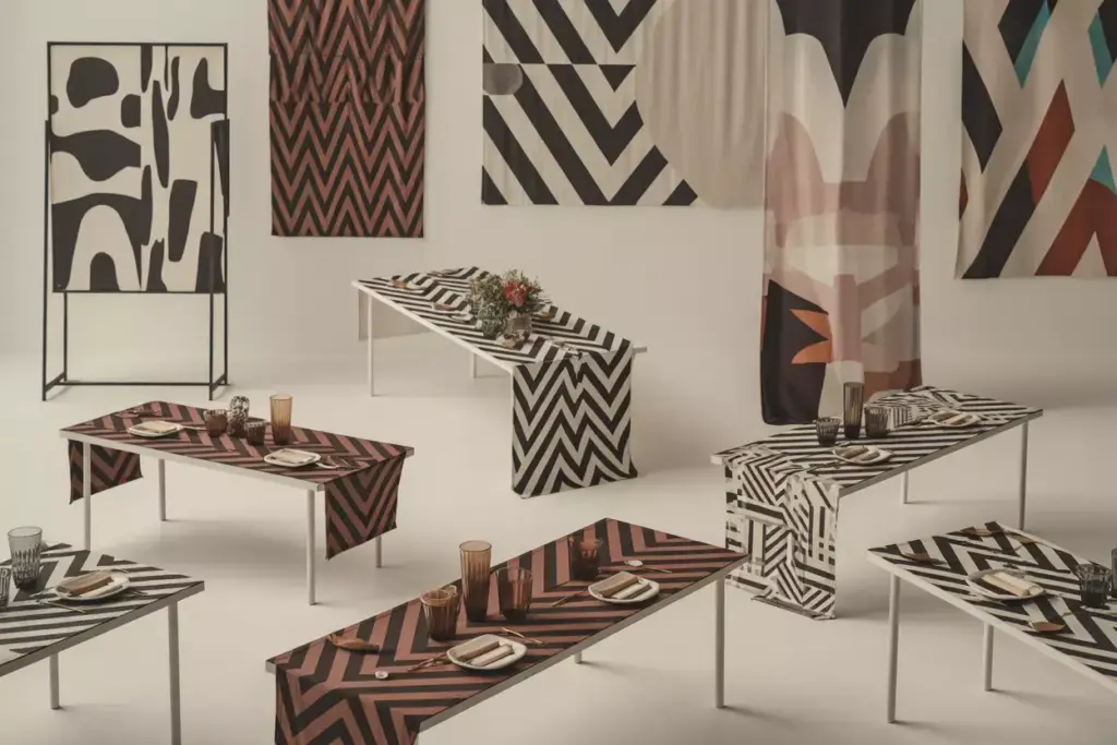 Wide angle modern geometric runners on minimalist tables