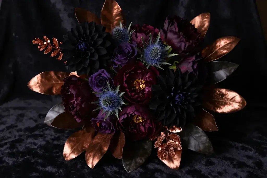 Dramatic dark moody bouquet burgundy dahlias metallic accents